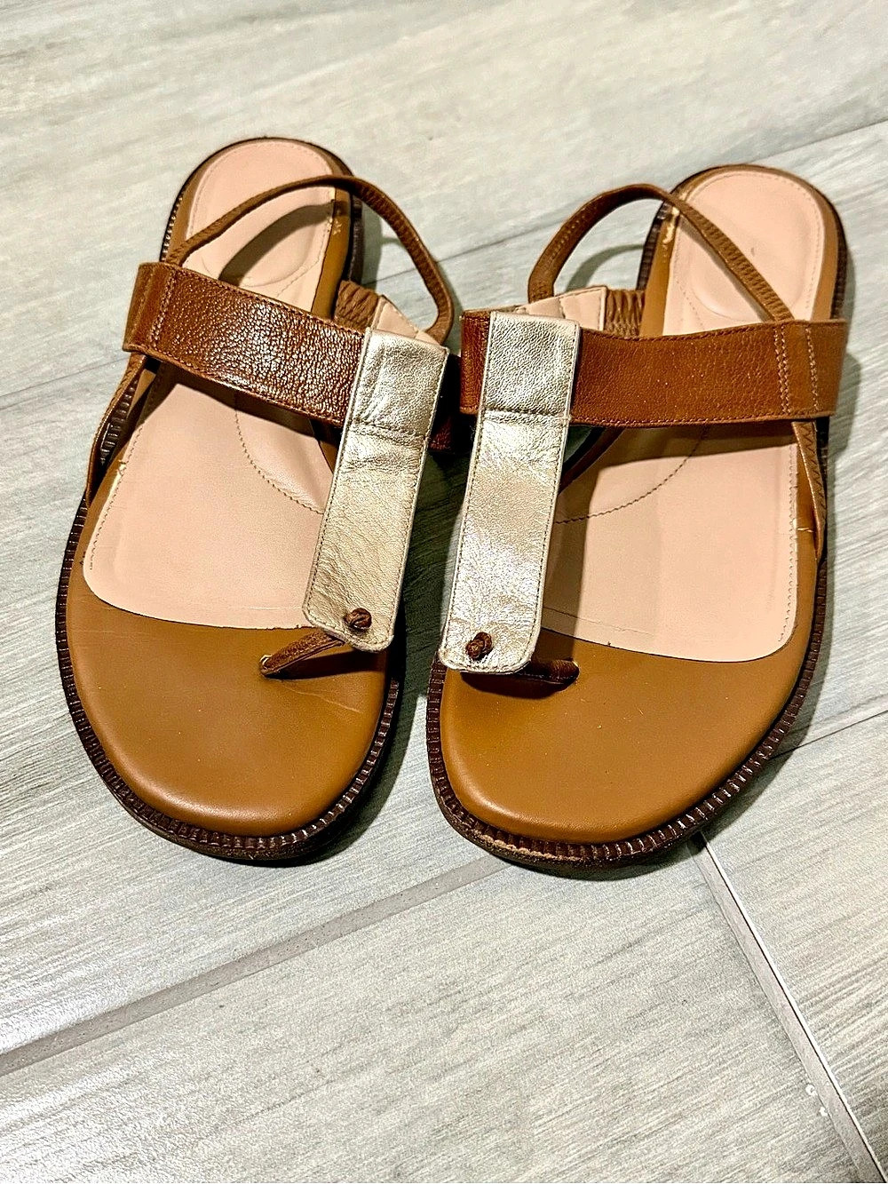 Cole Haan Winslet thong sandal featuring a tan leather upper and a rose gold 7.5